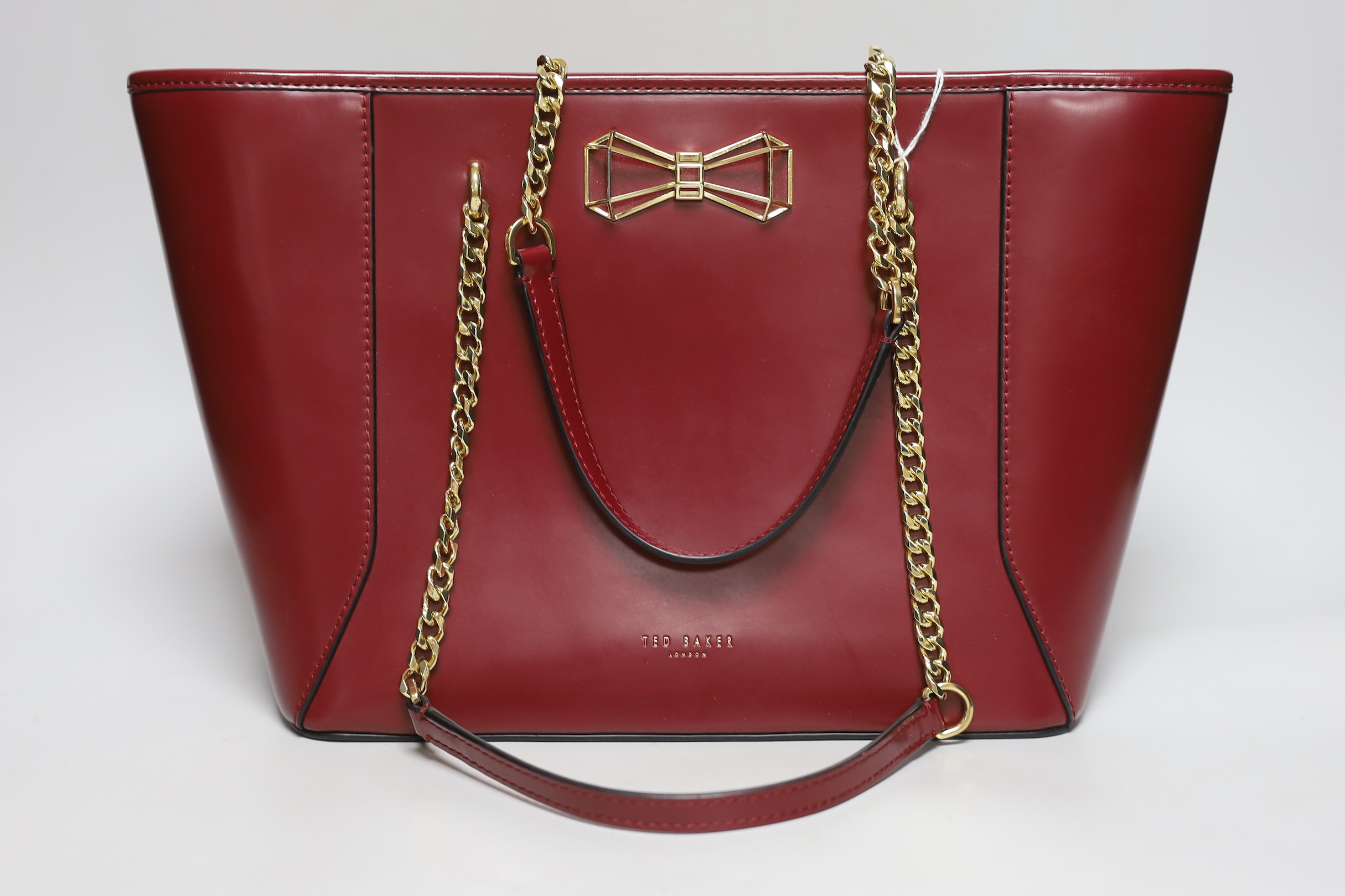 A Ted Baker maroon ladies “shopper” handbag and matching wallet